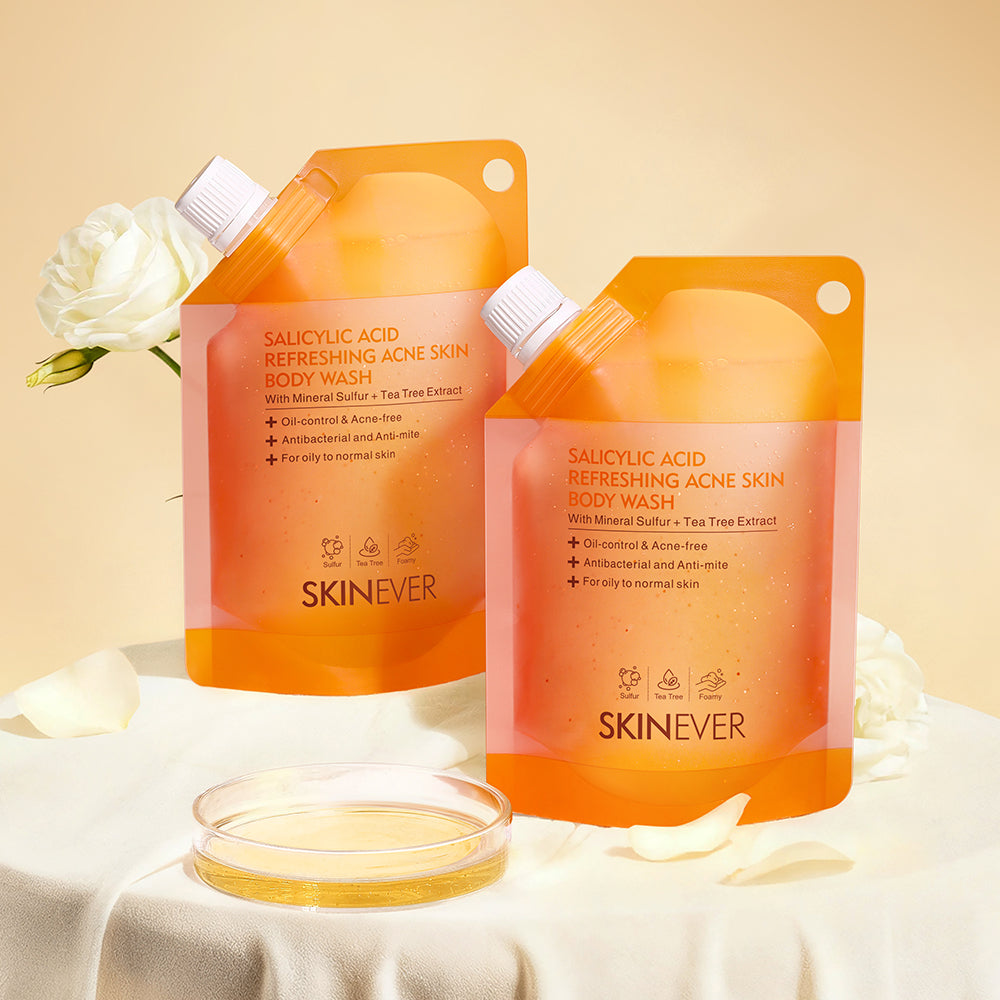 Two bottles of Skinever body wash on a beige background with a white flower.