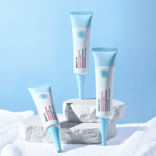 Three skincare tubes with blue and white design on a light blue background