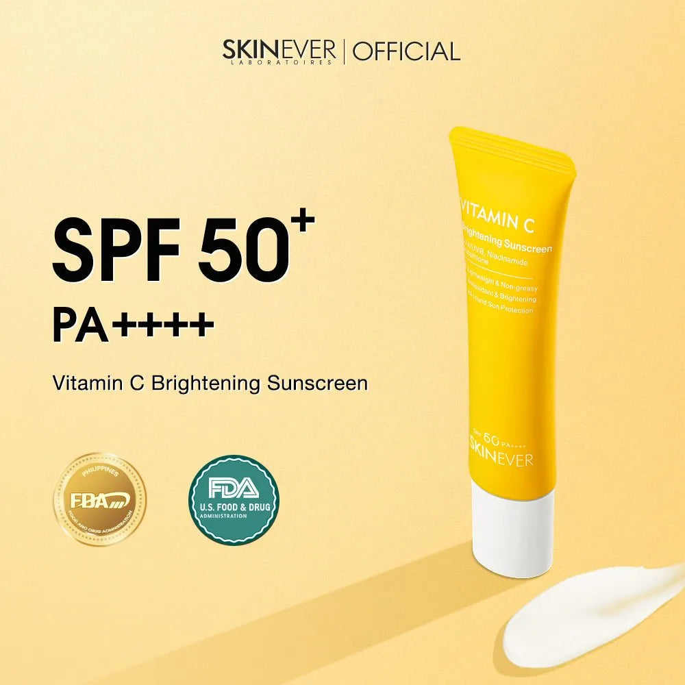 SKINEVER Vitamin C Brightening SPF 50+ sunscreen in a yellow squeeze tube with a white cap, shown on a warm beige background with product text, certification seals, and a smear of white cream.